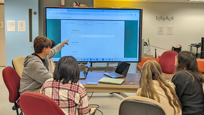 Students in front of screen