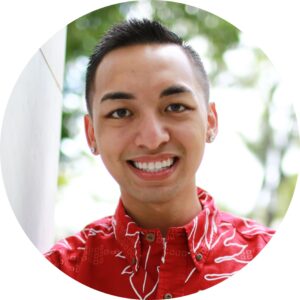 Smiling man with short black hair and a red aloha shirt