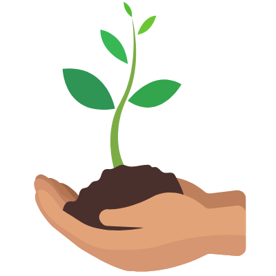 Hand holding a growing plant in soil.