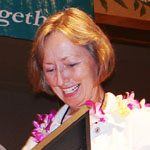 Jennifer_Lang Jennifer Lang receiving an award with a lei on.